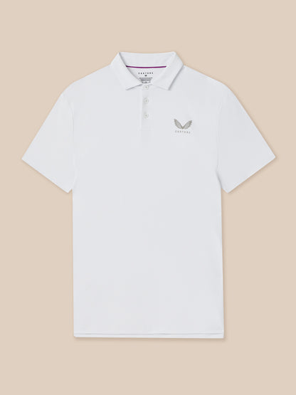 White polo shirt with a logo on a beige background