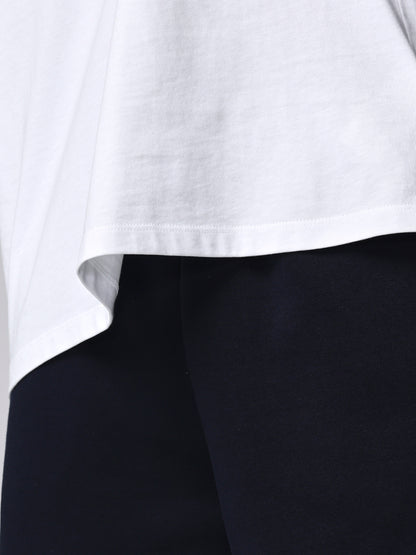 Close-up of a white shirt collar with black fabric underneath