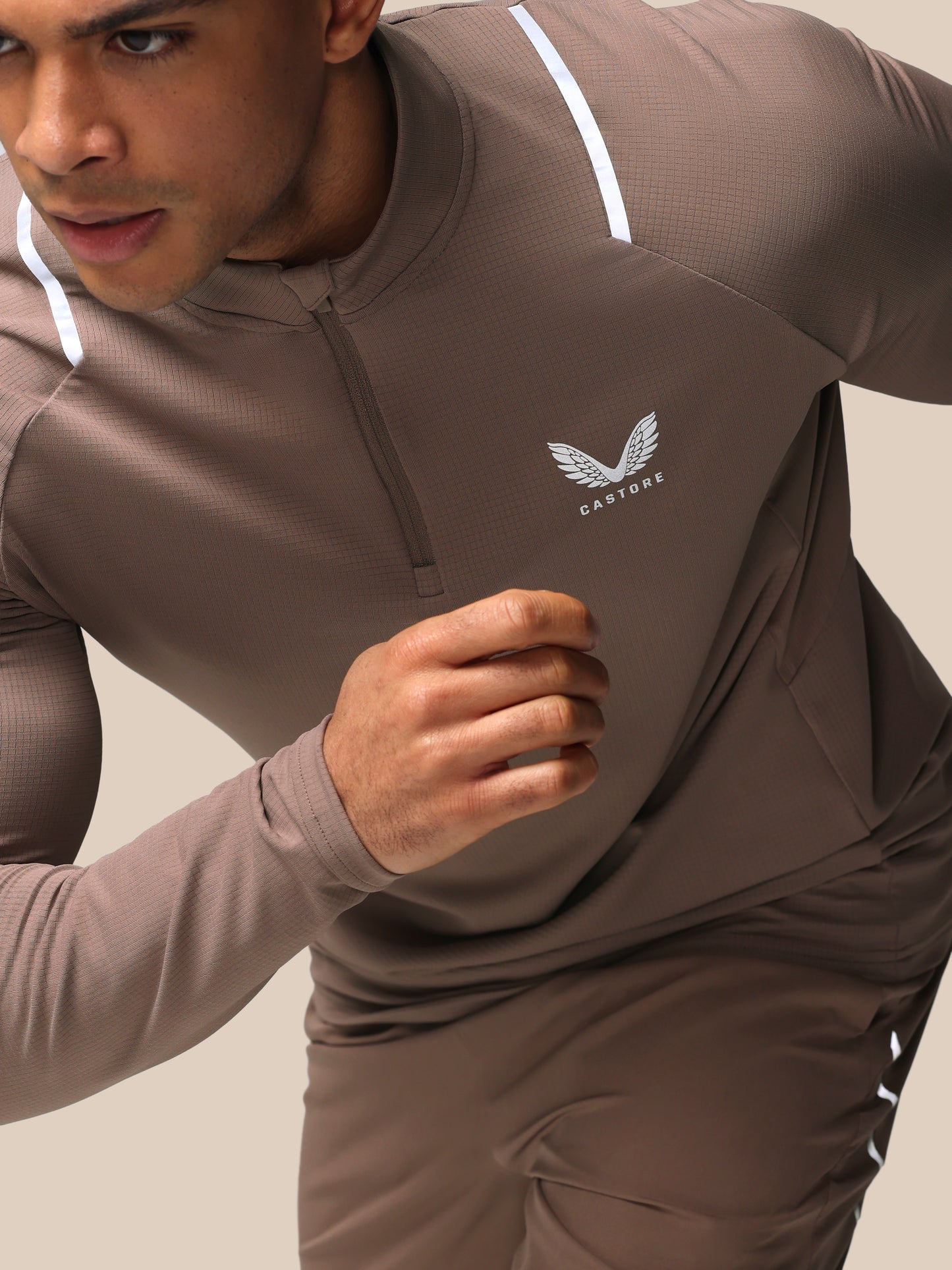 Taupe Apex training quarter zip top with chest logo white shoulder stripe and textured grid knit fabric