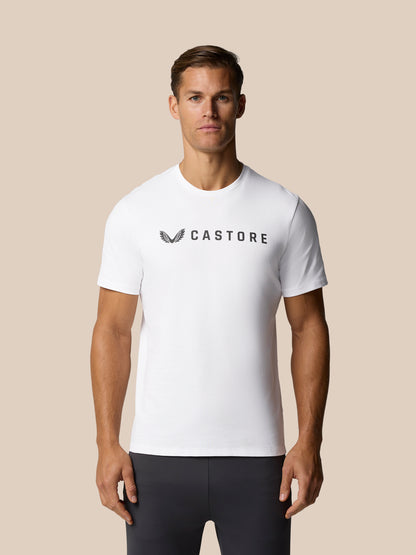 Male model wearing white Castore Graphic Lifestyle T-Shirt with the Castore wordmark across the chest