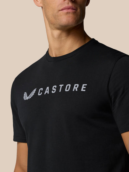 Close-up of the Castore logo and wordmark on a black T-shirt