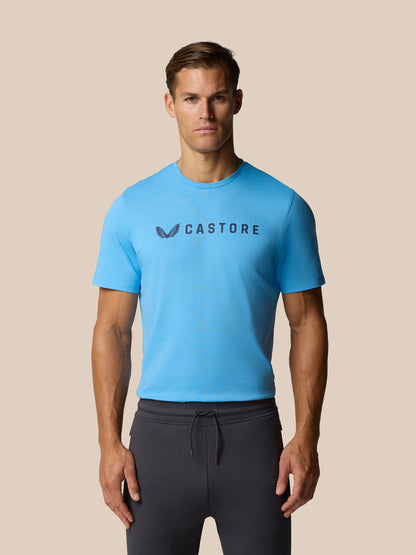 Man wearing cool blue Castore graphic lifestyle T-shirt with front logo