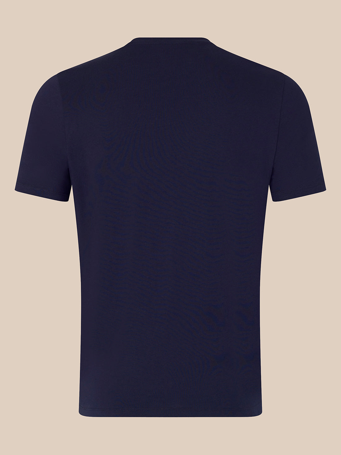 A plain navy blue short-sleeve crewneck t-shirt shown from the back, displayed on a solid light beige background.