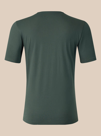A dark green short-sleeve crewneck t-shirt shown from the back, displayed on a solid beige background.