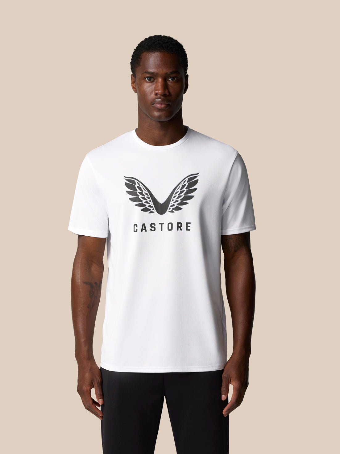 White Castore graphic T-shirt with large wings logo on the chest