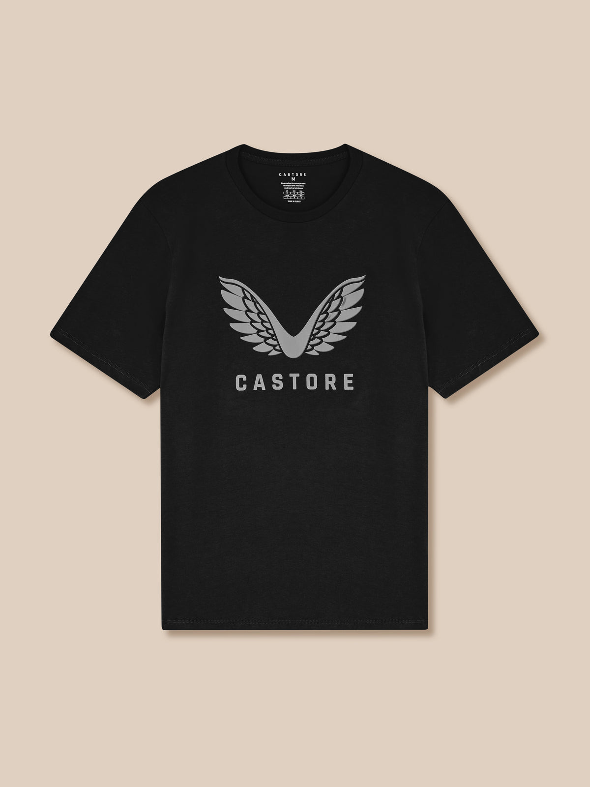 Black t-shirt with 'Castore' logo on a beige background