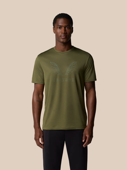 Male model wearing ivy green Graphic Training T Shirt with subtle wings graphic on chest