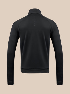 A black long-sleeve quarter-zip pullover shown from the back, featuring a high collar and a small vertical brand text print on the upper back, set against a solid beige background.
