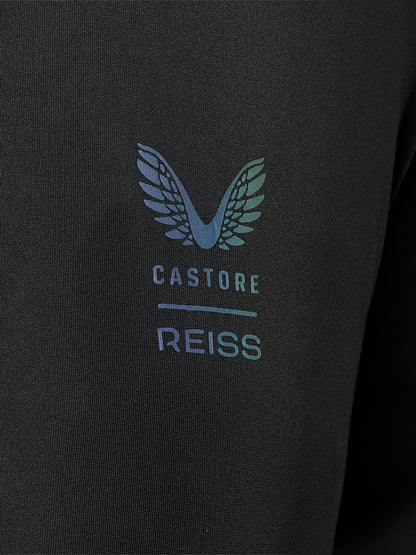 Close-up of a black textured fabric garment featuring a printed winged logo and the text 'CASTORE REISS' in a light blue and teal gradient.