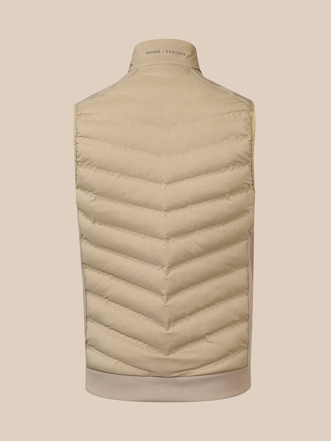 A light beige puffer vest shown from the back on a mannequin, featuring chevron quilting and a ribbed collar, hem, and cuffs.