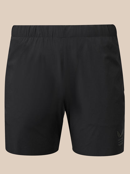 Back view of black 5 inch deep split shorts with an elastic waistband and small branding on the lower right