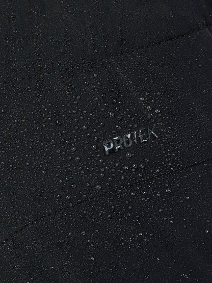 Close up of black fabric with water droplets and a small PROTCK logo.