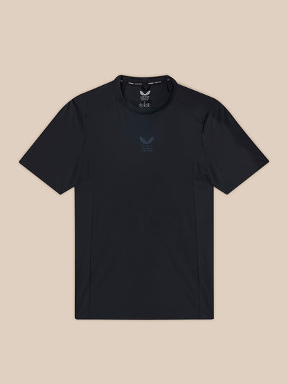 Black t-shirt with a logo on a beige background