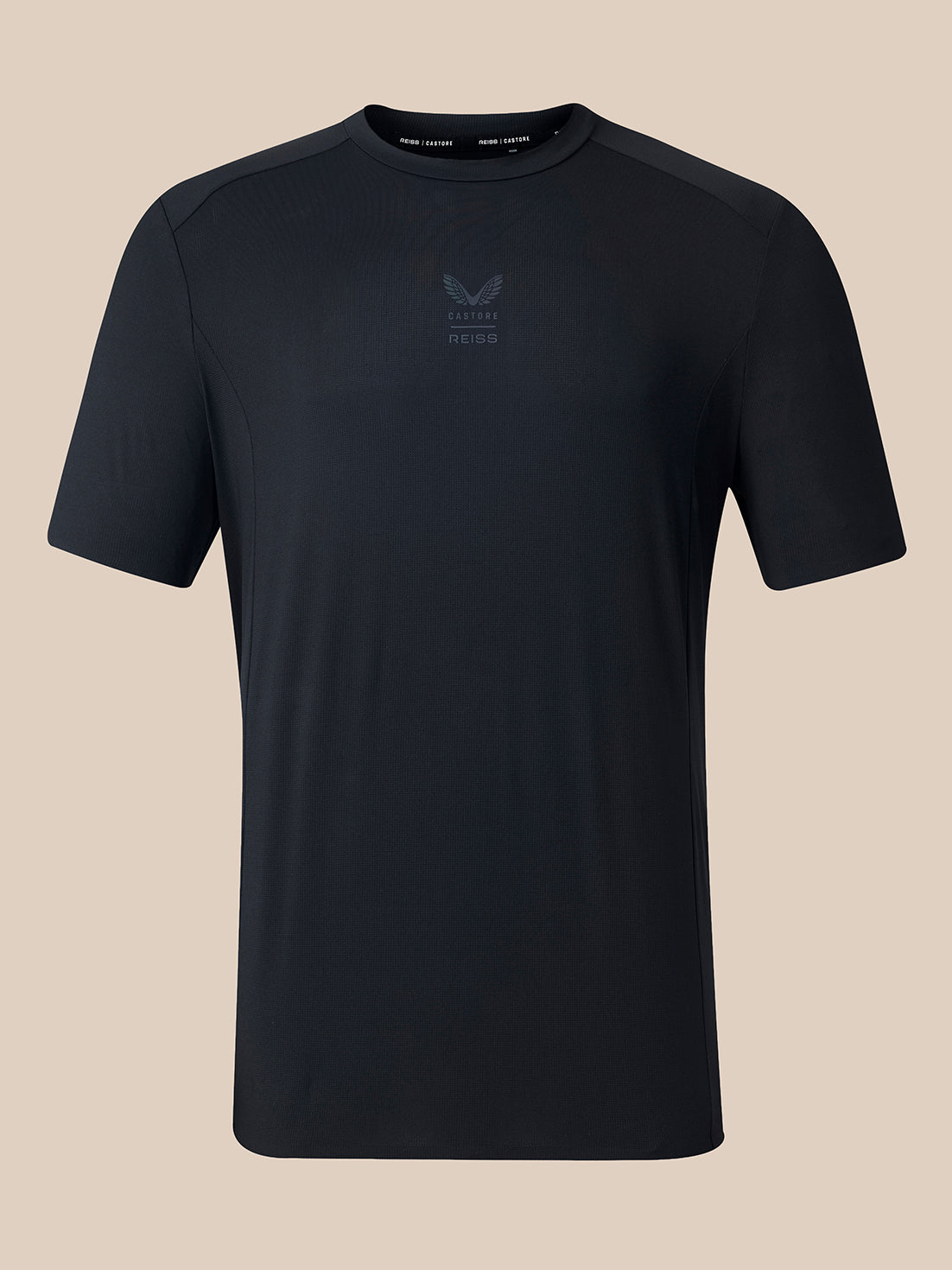 A black short-sleeve athletic t-shirt with a subtle tonal logo on the center chest, displayed against a solid beige background.