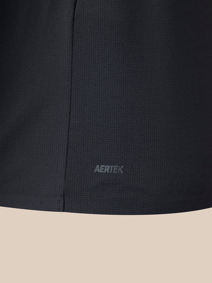 Close-up of a dark charcoal gray textured athletic fabric with the AERTEK logo embroidered near the bottom hem, set against a solid beige background.