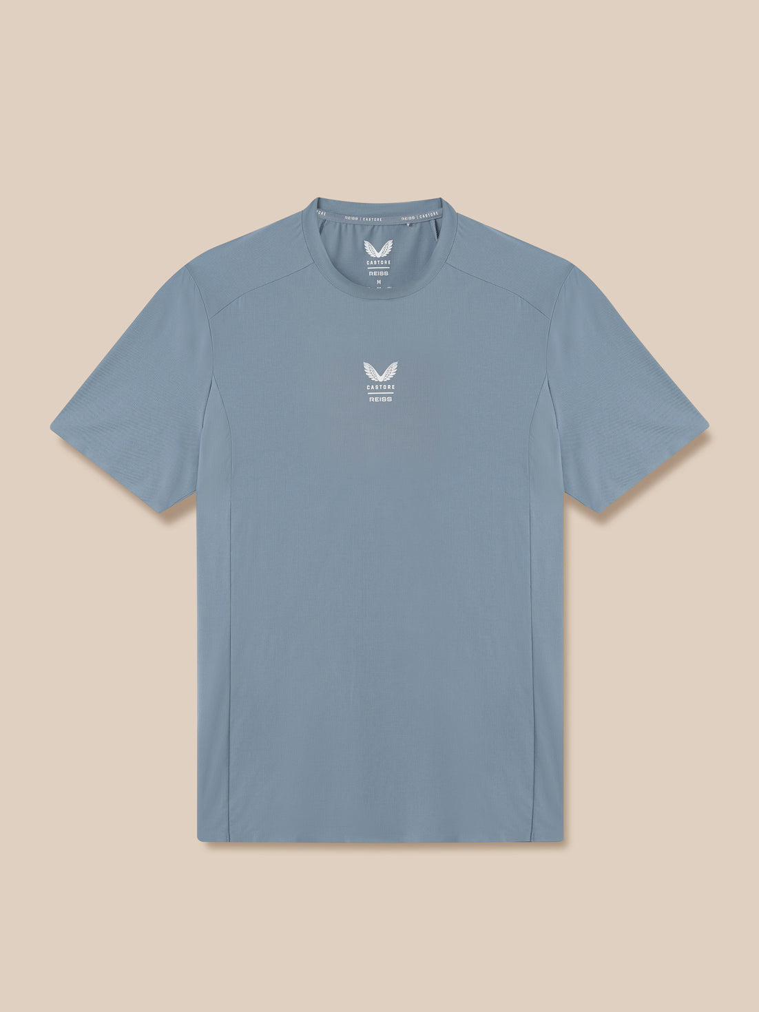 Blue t-shirt with a logo on a beige background