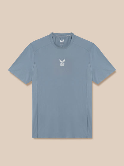 Blue t-shirt with a logo on a beige background