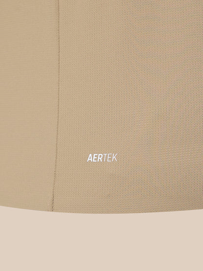 Close-up of a beige textured fabric surface with a visible seam and the word AERTEK printed in small white text near the center.