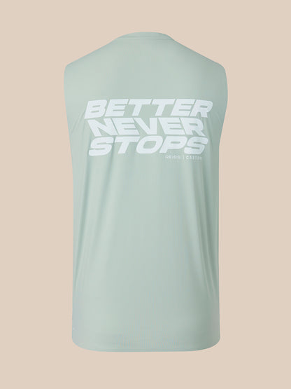 A sleeveless athletic tank top in a pale mint green color, shown from the back with a large white graphic text reading 'BETTER NEVER STOPS' on the upper back, set against a solid beige background.