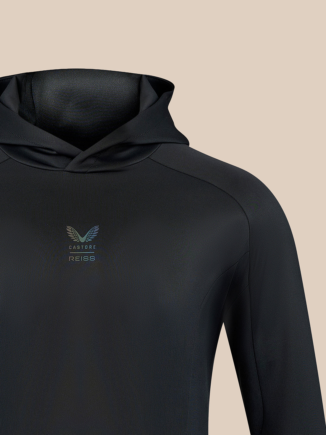 Black hoodie chest with small centered Castore REISS logo