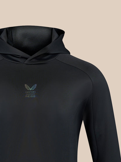 Black hoodie chest with small centered Castore REISS logo