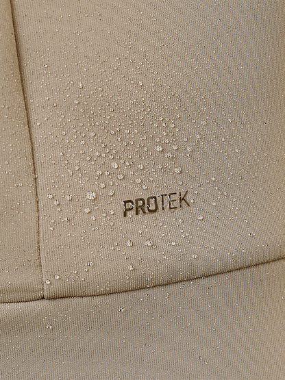 Close-up of beige fabric with water droplets and PROTEK branding