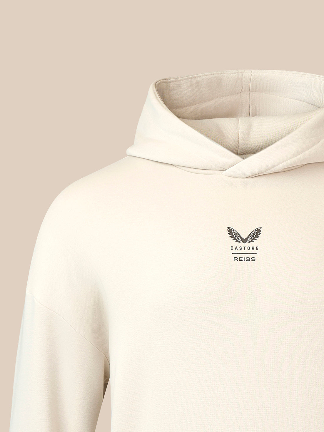 Stone oversized hoodie with chest logo showing wings and Castore Reiss branding