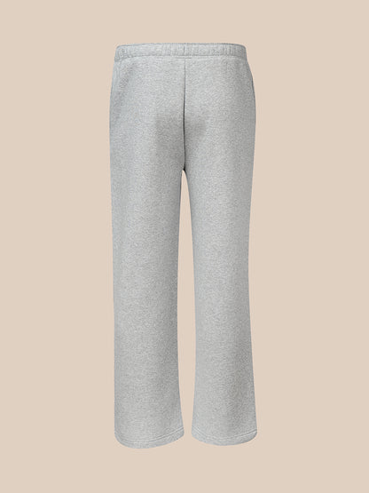 Back view of light grey fleece joggers with a wide leg silhouette