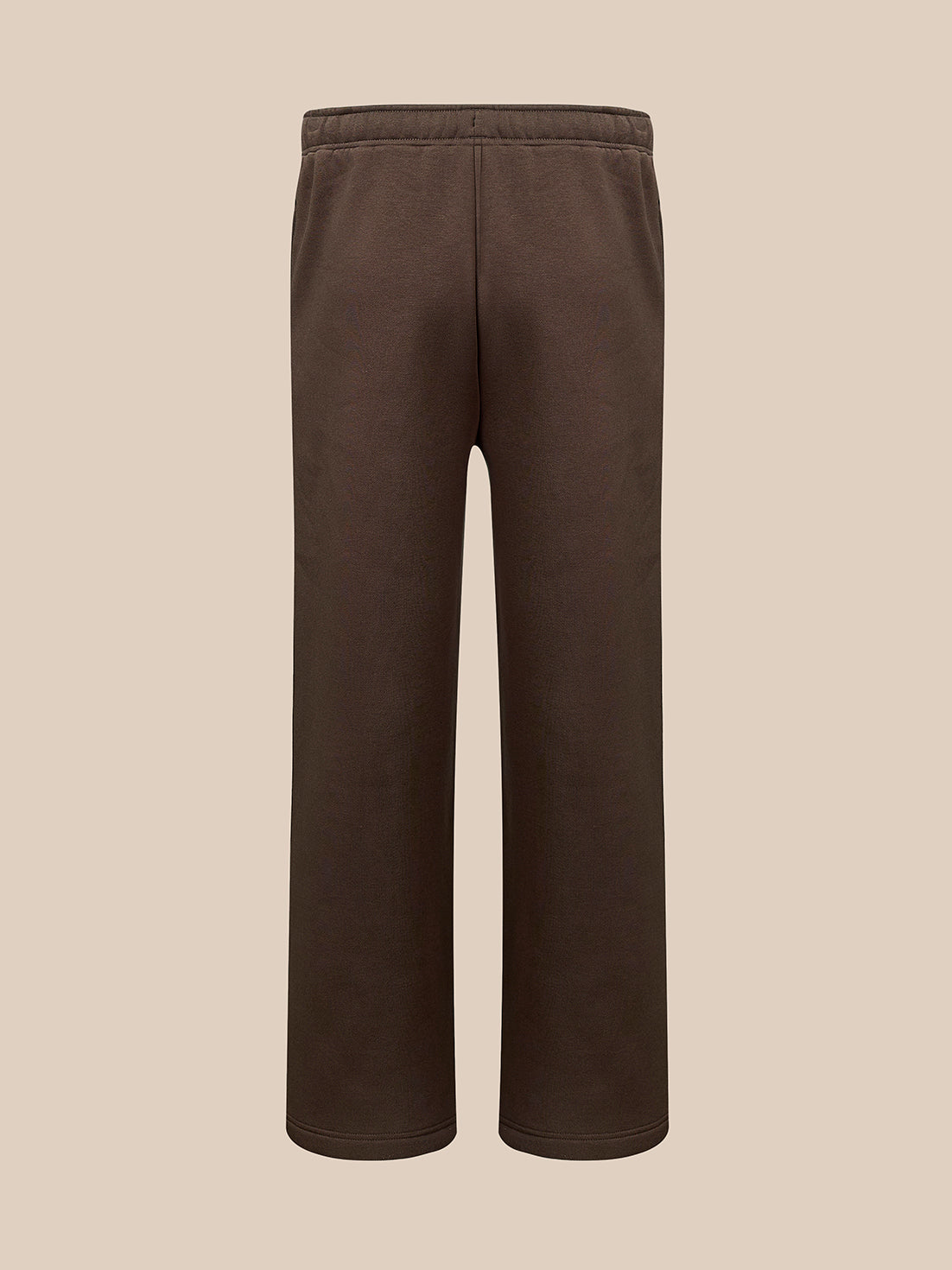A pair of dark brown sweatpants with a drawstring waist , shown against a solid beige background.