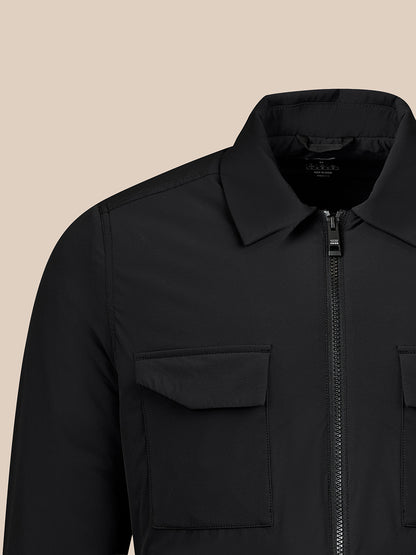 Close-up of a black jacket on a white background