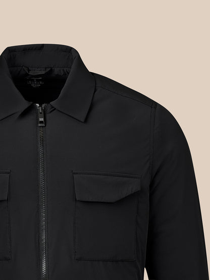 Black men's Reiss jacket close up of upper torso with front zipper and two chest pockets