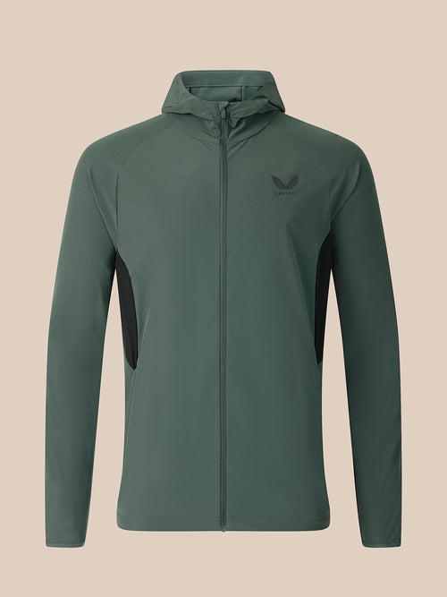 Dark green jacket on a beige background