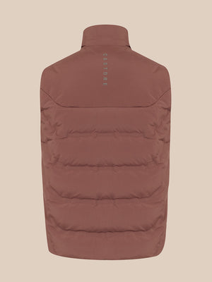 A brown puffer vest shown from the back, featuring horizontal quilting and a small vertical 'CASTORE' logo printed on the upper back, set against a solid beige background.