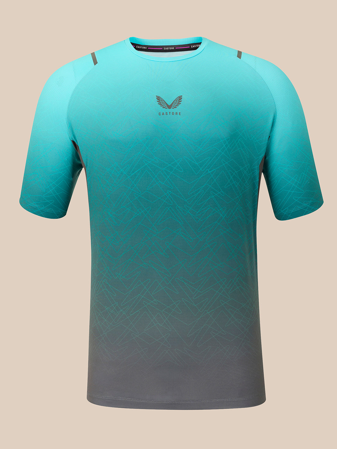 A short-sleeve athletic t-shirt with a gradient design, fading from a bright teal at the top to a dark gray at the bottom, featuring a subtle geometric pattern and a winged logo on the chest.