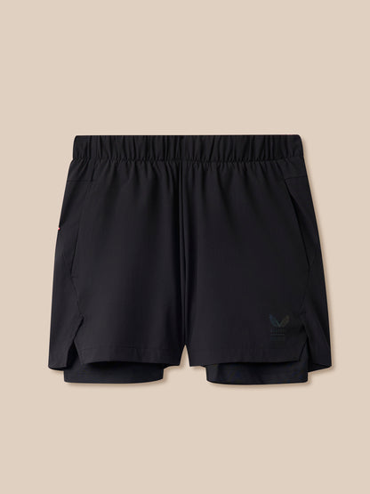 Black athletic shorts on a beige background
