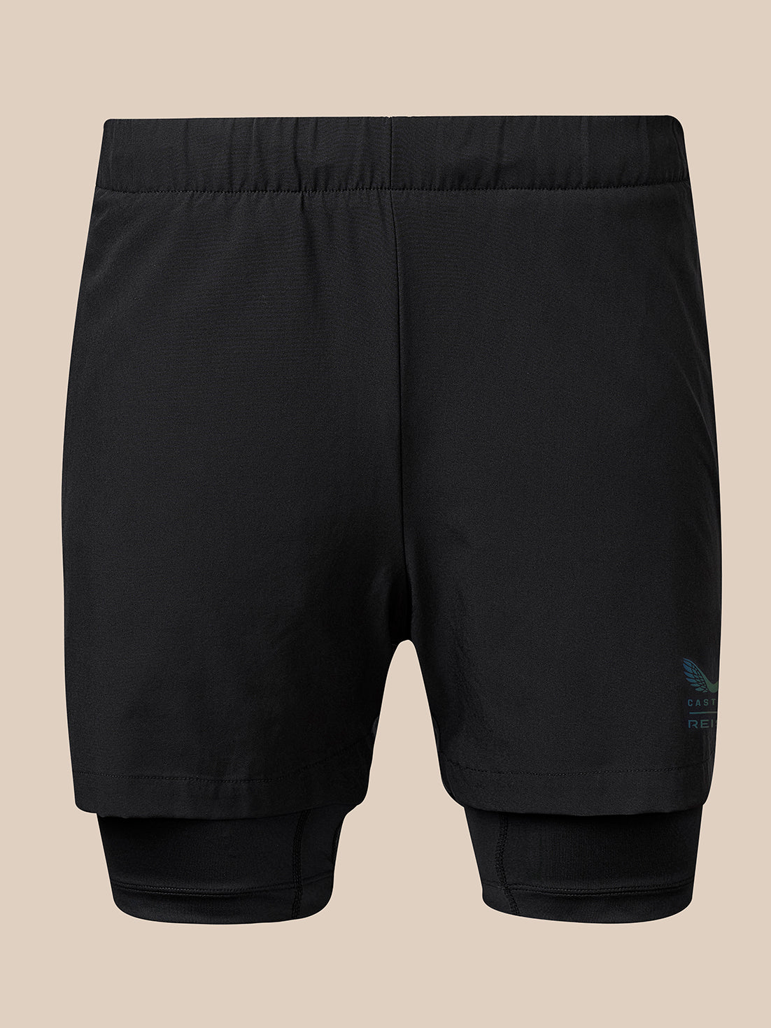 Black athletic compression shorts with an integrated inner layer, shown from the back against a solid beige background.