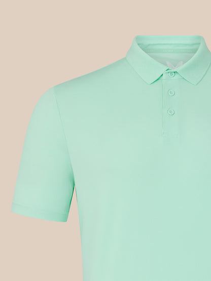 Close-up of the mint green polo collar with button placket.