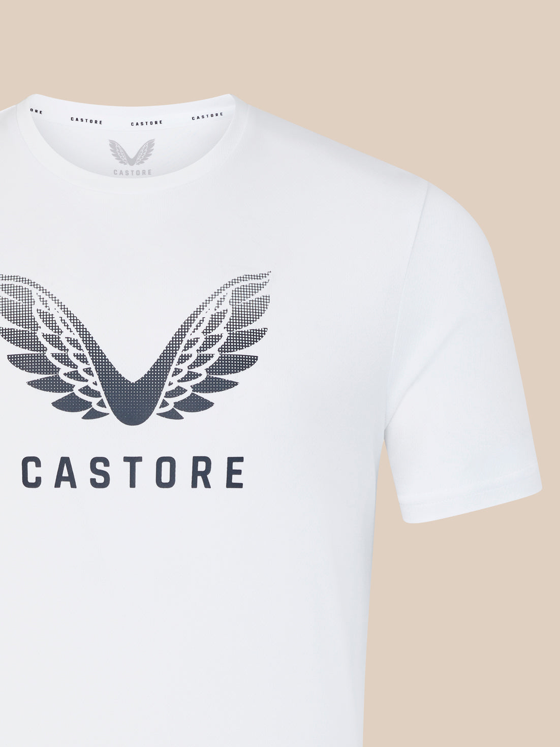 White t shirt close up showing the large wing logo and CASTORE branding