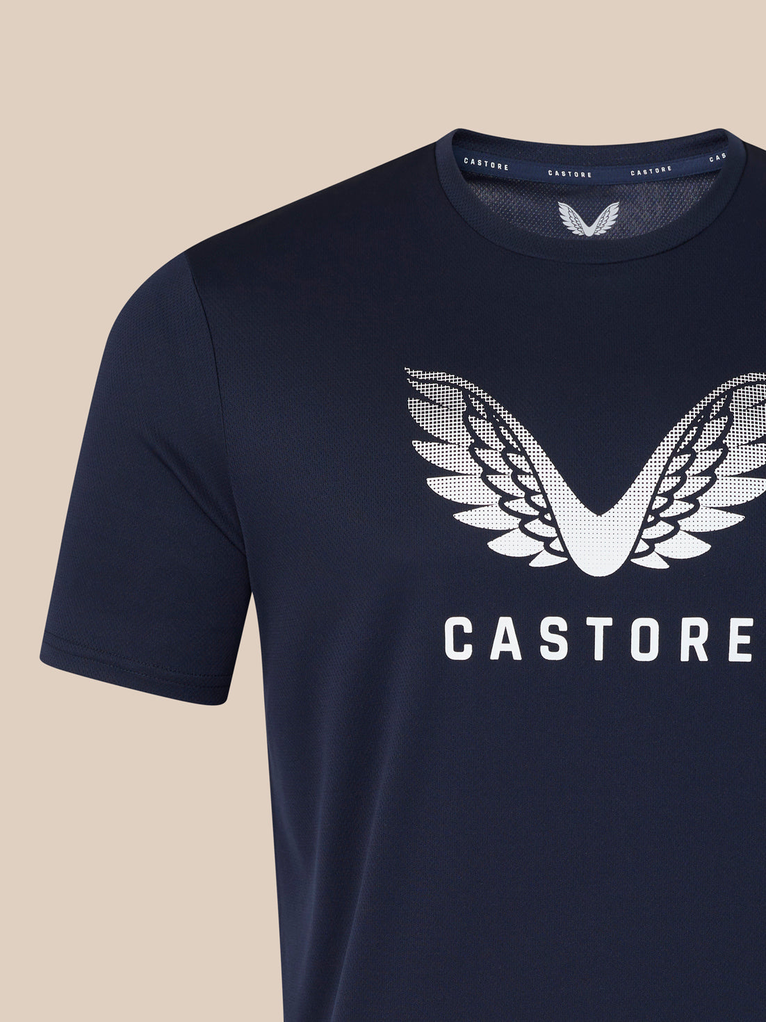 Navy men's Wings graphic T shirt with white wing emblem and CASTORE across the chest