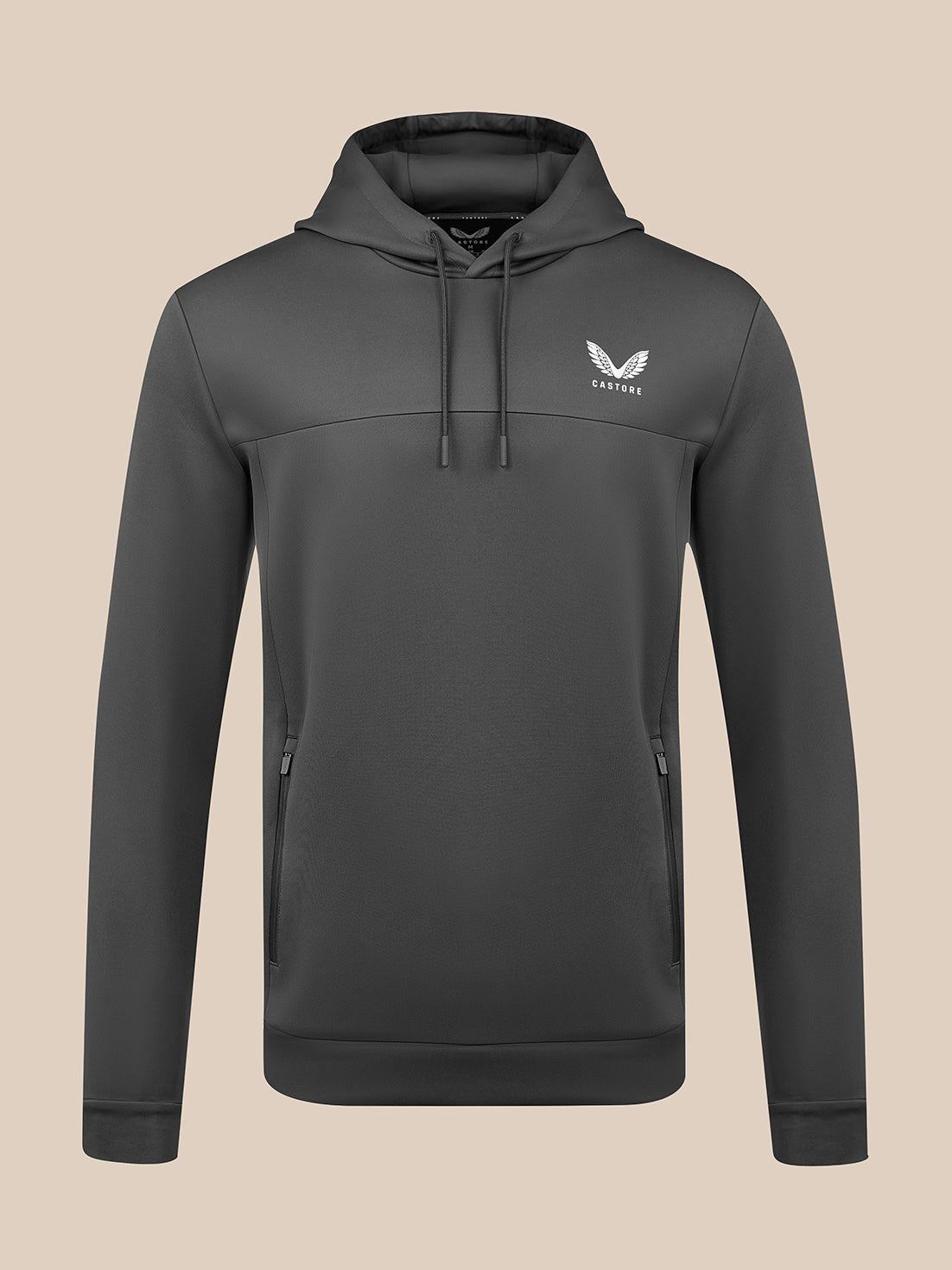 A dark gray pullover hoodie with a drawstring hood and a white winged logo on the left chest, displayed on a solid beige background.