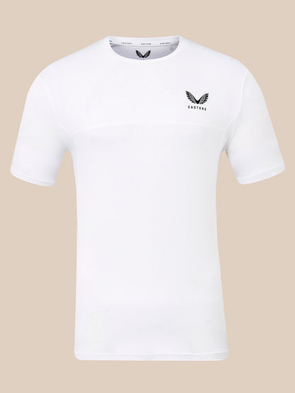 A white short-sleeve athletic t-shirt with a black winged logo and the word 'CASTORE' printed on the left chest, displayed against a solid beige background.