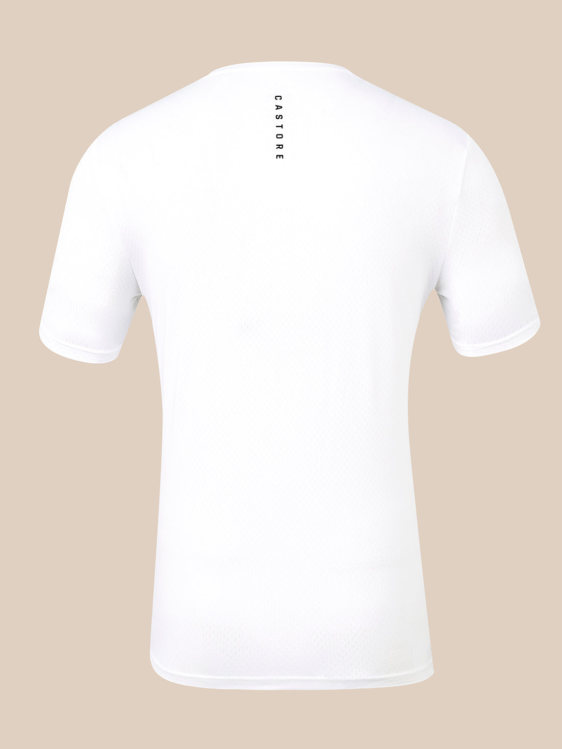 White short-sleeve athletic t-shirt shown from the back, featuring a vertical black 'CASTORE' logo printed on the upper back, set against a solid beige background.