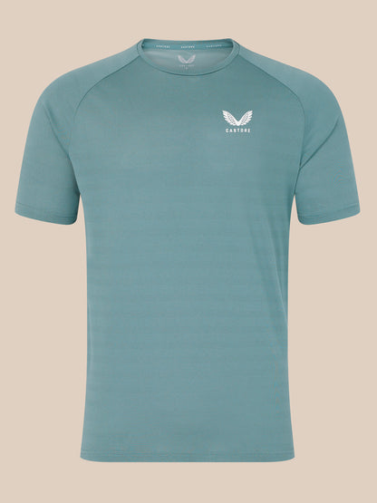 Blue short sleeve performance T shirt with a subtle textured pattern and a small white Castore logo on the chest.