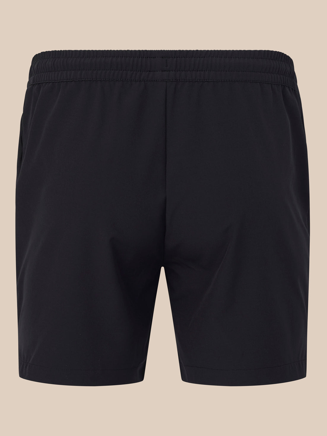 Back view of black shorts with elastic waistband and a vertical center seam