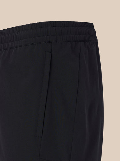 Close-up of the elastic waistband on black men's 6 inch training shorts