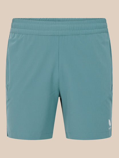 Teal blue 6 inch training shorts back view with white Castore logo near the hem.