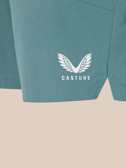 Close up of the lower side panel on blue shorts showing the white Castore wing logo
