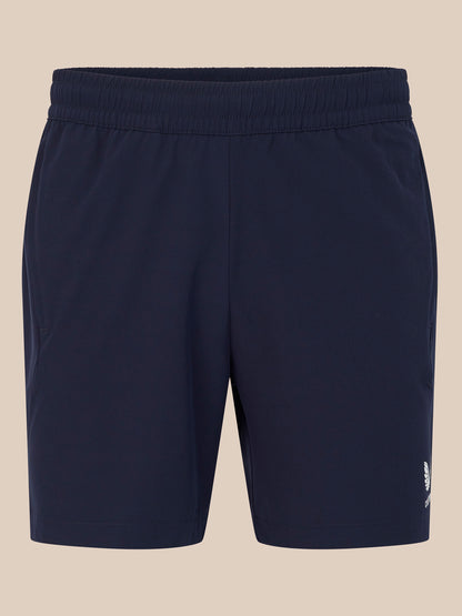 Front view of navy 6 inch training shorts with elastic waistband.
