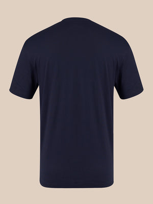 A dark navy blue short-sleeve crewneck t-shirt shown from the back, displayed on a solid beige background.