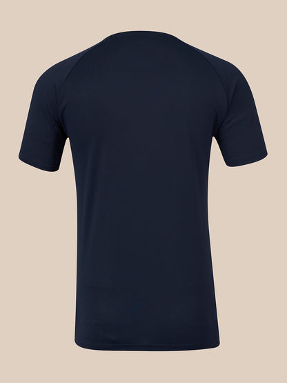 A dark navy blue short-sleeve athletic t-shirt shown from the back, displayed on an invisible mannequin against a solid beige background.